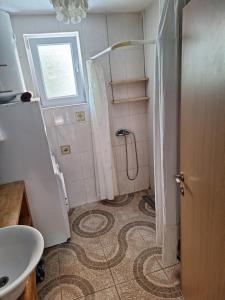 a bathroom with a shower and a sink at SunnyDay House in Masline +46 photos