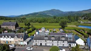 an aerial view of a town with mountains in the background at Callander Hostel in Callander