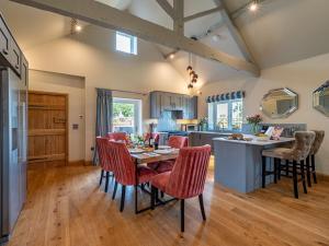 a kitchen and dining room with a table and chairs at 3 Bed in Madley 83659 in Madley