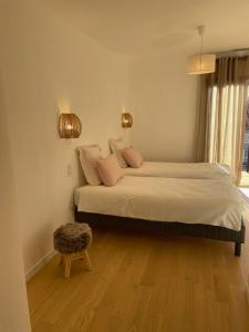 Una cama o camas en una habitación de La Calanca - Appartement d'hôtes Centre ville de Sète parking gratuit