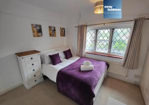 a small bedroom with a bed and a window at St Martins Square Chichester in Chichester
