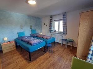 Postel nebo postele na pokoji v ubytování Landhaus Graßmann