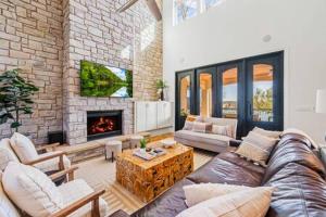 a living room with a couch and a fireplace at Beachfront Villa New Listing Intro Pricing in Kingsland