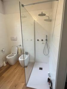 a bathroom with a shower and a toilet at Bloom as you are in Bologna