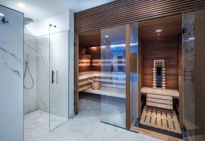 a bathroom with a walk in shower and a toilet at Rosenhof Salzburger Seenland in Strasswalchen