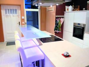 a kitchen with a counter with a blue counter top at Altes Backhaus in Bad Harzburg