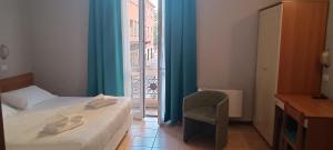 Postel nebo postele na pokoji v ubytování Hotel Nuovo Rondò