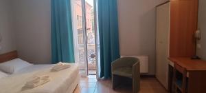 Postel nebo postele na pokoji v ubytování Hotel Nuovo Rondò