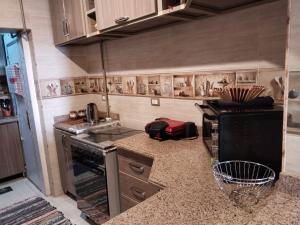 a kitchen with a stove and a counter top at شقة راقية مطلة علي كورنيش النيل المعادي - عوائل فقط in Cairo