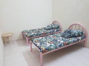 Vuode tai vuoteita majoituspaikassa Damai Eco Homestay Nilai Negeri Sembilan