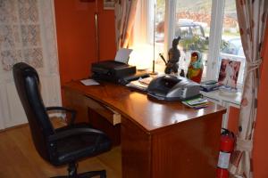 an office with a desk with a telephone on it at Angelas Fjord Suite in Stamsund