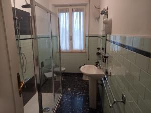 a bathroom with a glass shower and a sink at Casa Zi' Peppe in Capranica