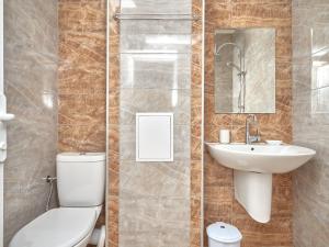 a bathroom with a toilet and a sink at Relax Larrisa Studio in Primorsko +42 photos