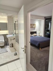 a bedroom with a bed and a bathroom at off 13 in London