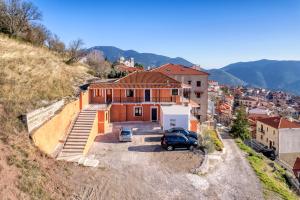 an aerial view of a house with a car parked in a driveway at Arachova's Experience M2 in Arachova