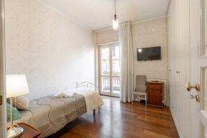 TV a/nebo společenská místnost v ubytování B&B Frida Suite Home
