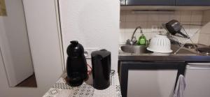 a small kitchen with a sink and a counter top at #L8 Le Montorge City center Studio Fully equipped in Grenoble +1 photo