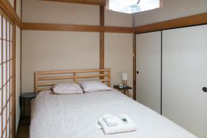 Postel nebo postele na pokoji v ubytování GC01/生活してもOKな親切な部屋 /3 部屋/最大 6人入居/大阪城/3 ライン駅徒歩7分/清潔