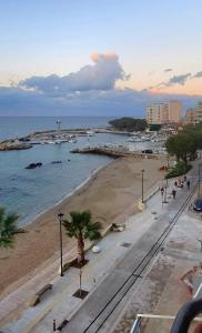 a view of a beach with boats in the water at Villa Katerina in Chania