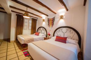 Postel nebo postele na pokoji v ubytování Vilas Insight Hotel Machupicchu