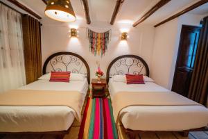 Postel nebo postele na pokoji v ubytování Vilas Insight Hotel Machupicchu