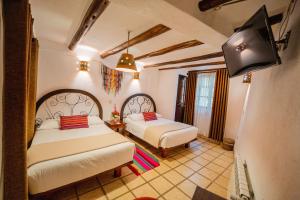 Postel nebo postele na pokoji v ubytování Vilas Insight Hotel Machupicchu