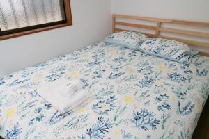 Postel nebo postele na pokoji v ubytování GC01/生活してもOKな親切な部屋 /3 部屋/最大 6人入居/大阪城/3 ライン駅徒歩7分/清潔