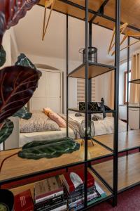 a room with a bunk bed and a book shelf with books at K1 Piatok Sobota Disco Cez tyzden tichy apartman in Košice