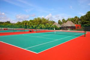 a tennis court with two tennis rackets on it at Bahia Principe Grand Coba - All Inclusive in Akumal
