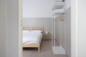 a small bedroom with a bed and a glass doorway at Duomo Apartment in Florence