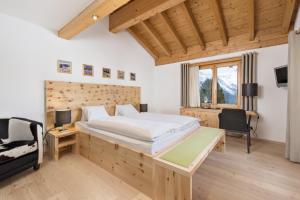 Rúm í herbergi á Berghotel Randolins