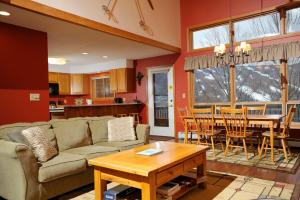 a living room with a couch and a table at The Townhomes at Bretton Woods in Bretton Woods