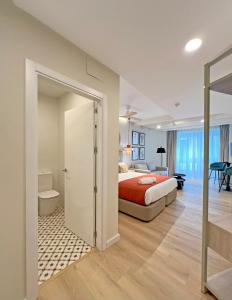 Apartamentos Soho Boutique Palillero客房内的一张或多张床位