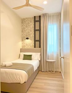 Apartamentos Soho Boutique Palillero客房内的一张或多张床位