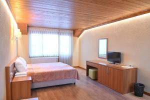 Postel nebo postele na pokoji v ubytování Къща за гости ГРАНИТ