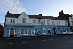 a blue and white building on the side of a street at The Wash & Tope in Hunstanton