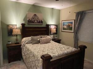 a bedroom with a large bed and two lamps at Scottsdale Retreat in Scottsdale