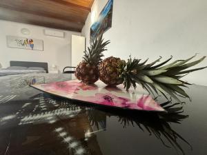 two pineapples sitting on top of a table at Mi casita Tenerife Sur Free WIFI e AC in Arona