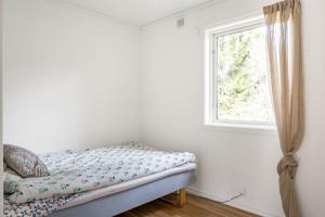 Ένα ή περισσότερα κρεβάτια σε δωμάτιο στο Cottage in Stockholm