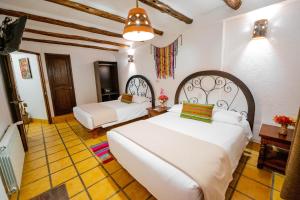 Postel nebo postele na pokoji v ubytování Vilas Insight Hotel Machupicchu