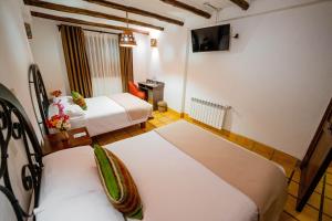 Postel nebo postele na pokoji v ubytování Vilas Insight Hotel Machupicchu