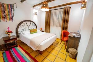 Postel nebo postele na pokoji v ubytování Vilas Insight Hotel Machupicchu
