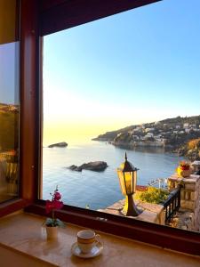 a large window with a view of the ocean at Apartments Antigona Old Town in Ulcinj