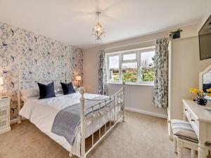 a bedroom with a bed and a window at 1 Bed in Great Torrington 89636 in Great Torrington
