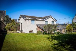 a large white house with a grass yard at Fonthill Bed and Breakfast Nairn in Nairn