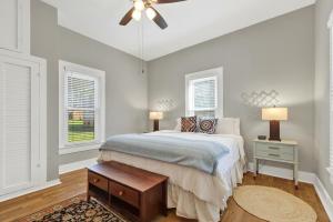 a bedroom with a bed and a ceiling fan at Austin Haus in Fredericksburg