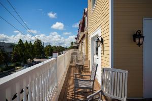 two chairs sitting on a porch of a house at Renaissance St. Augustine Historic Downtown Hotel in St. Augustine