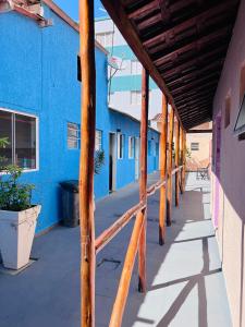 an empty hallway of a blue building at Pousada Villa Brasil Ocian in Praia Grande