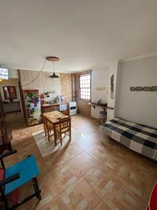 a living room with a bed and a table at Quinta Da Estalagem in Pirenópolis +43 photos