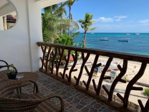 a balcony with a view of the beach at Little Mermaid Dive Resort in Malapascua Island